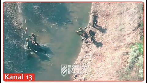 Drone pursues weary Russians dragging their wounded fellow soldiers and drinking water from a pond