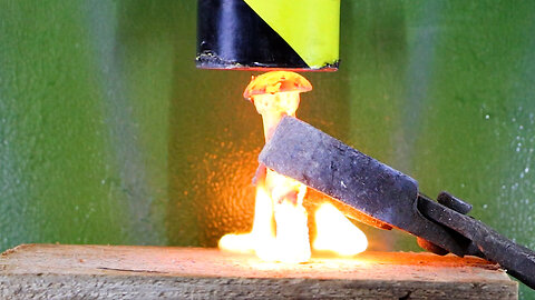 Red Hot Bolt Crushed Into Wood with Hydraulic Press