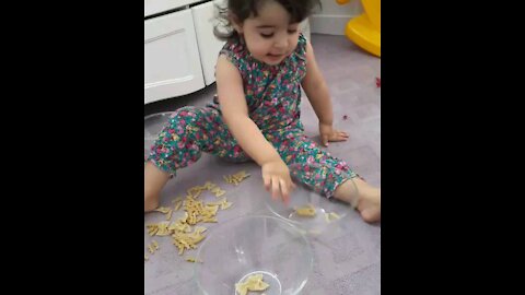 Our baby play with pasta