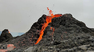 Iceland volcano erupts behind volleyball game