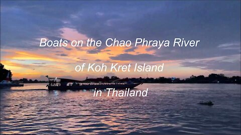 Boats on the Chao Phraya River of Koh Kret Island in Thailand