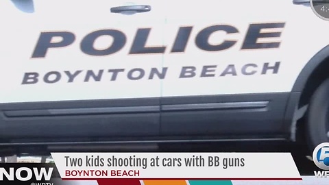 Two kids shooting at cars with BB guns