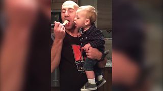 "Little Boy Leans In For Every Bite Of Cake His Dad Takes"