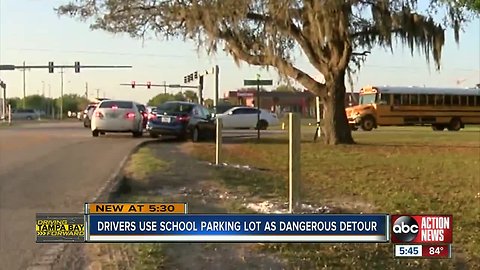 Private school in Riverview installs wooden stakes to stop drivers from cutting through its lot