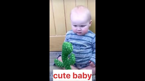 baby playing with cactus