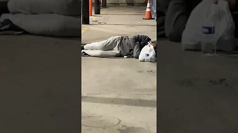 Homeless Man Sleeping on the Ground Greyhound Bus Terminal Albany NY State Capital