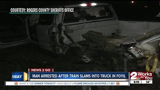Man arrested after train slams into truck