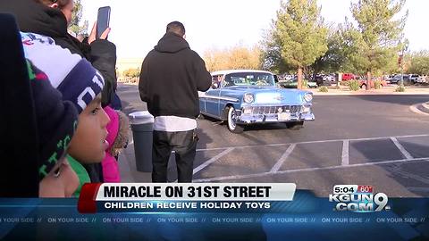 Thousands of Tucson kids meet Santa and get presents at the Miracle on 31st Street