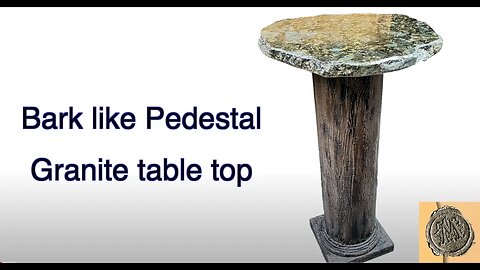 Bark like pedestal (hand crafted) with a Granite table top.