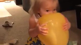Little Girl Bites a Balloon and Begins To Cry When It Pops