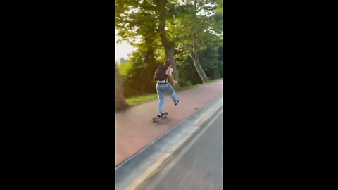 Skateboarding downhill on our way to a spanish party