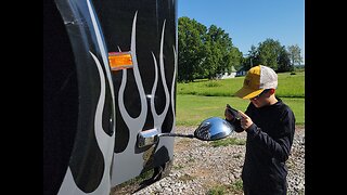 PREPARING TO REMOVE THE HOOD OFF THE FREIGHTLINER