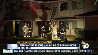 Firefighters rescue man inside of burning home