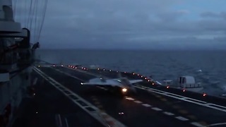 Naval fighter MiG-29K twilight landing to aircraft carrier