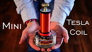 DIY 50,000 Volt Arc Lighter Powered Tesla Coil (ft. Integza)