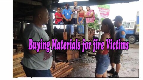 Fire Victims Receive Building Materials Naga city Philippines 1 of 2