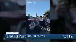 Driver plows through crowd of protesters on I-244