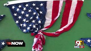Cincy family buys flag that survived Florence