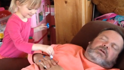 Cute Girl Puts Nail Polish On Her Dad’s Fingers