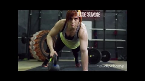 A Woman Lifting A Cast Iron Kettle Weights While In A Push Up Exercise Position