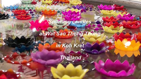 Spinning candles at wat Wat Sao Thong Thong Koh Kret Thailand