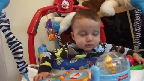 Exhausted baby jumps himself to sleep