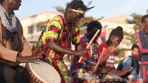 Lovely African traditional Drum music and dancing performed on the street.