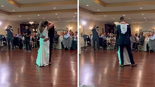 Newlyweds Surprise Guests With Onesie During Their Dance