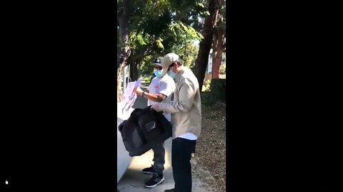 Some ununiformed random guys picking up ballots in a makeshift van in LA county