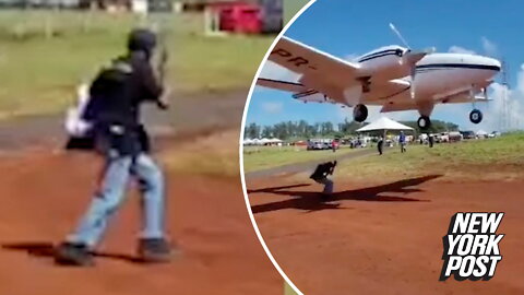 Plane nearly decapitates idiot on the runway