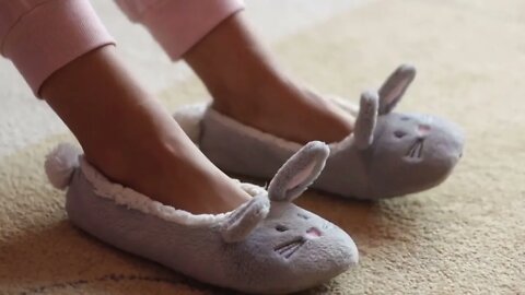 female legs with slippers rabbits