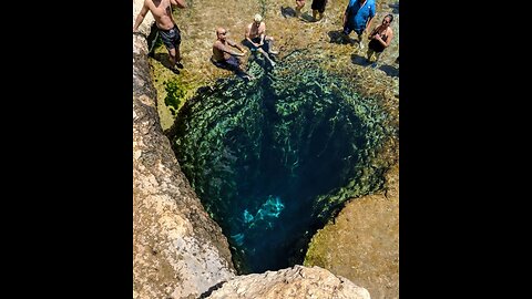 Jacob's Well in Texas. The depth of the well makes its bottom inaccessible.