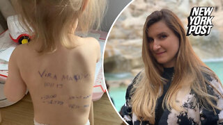 Ukrainian mom wrote family's phone number on young daughter's back