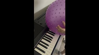 Jimmy the ball playing Piano