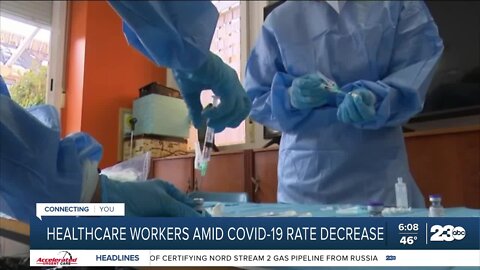 Healthcare workers amid COVID-19 rate decrease