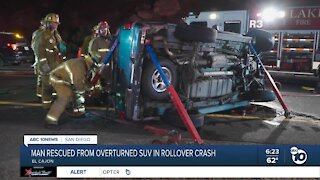 Man rescued from overturned SUV rollover crash
