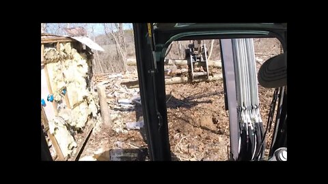 Bobcat e42 mini excavator pulling stumps & clearing land