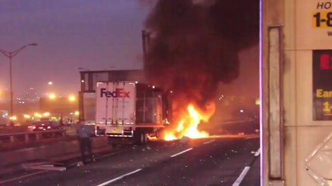 FedEx Tractor Trailer almost goes over barrier 80ft fall bursts into flames NJ Turnpike fire