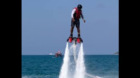 Teacher-Student Duo Dances While Hydroflying Over Water