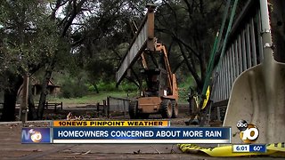 Homeowners clean up after massive storm