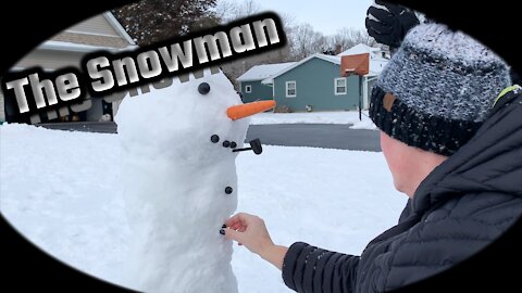 A Snowman takes shape in the front yard