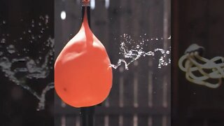 Slingshot vs. Water Balloon
