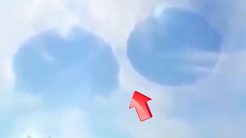 Two large saucer-shaped UFOs were seen in the cloudy sky above [Space]