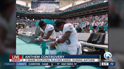 Two Miami Dolphins players kneel during National Anthem