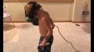 Kid hits the wall while playing VR game
