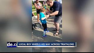 Superstar kid: Wheeling his way across triathlon finish line