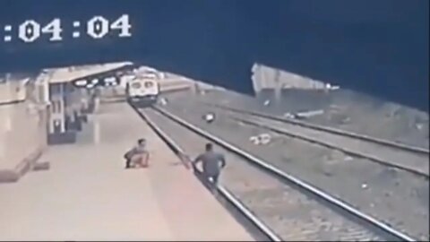 MAN SAVES CHILD'S LIFE FROM ONCOMING TRAIN IN HEART-STOPPING VIDEO