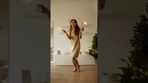 Woman Dancing while Holding Sparklers Beautifully
