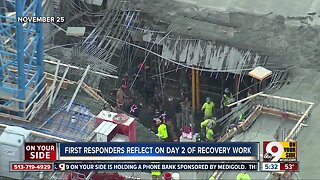 Urban Search and Rescue Teams aid in recovery efforts at building collapse site