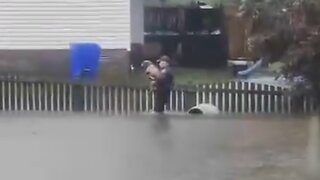 Police Rescue Dog From Rising Floodwaters